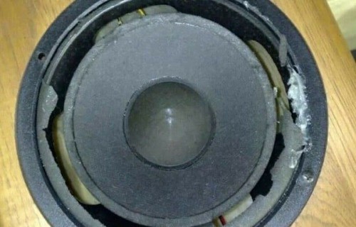 Blown subwoofer as one cause of subwoofer rattle and vibration